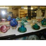 A mixed lot of coloured glass bud vases.