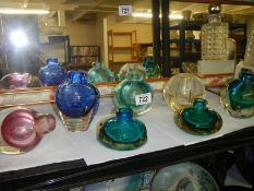 A mixed lot of coloured glass bud vases.