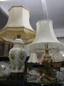 A floral ceramic table lamp and one other.