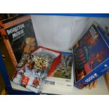 A quantity of jigsaw puzzles.