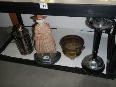 A cast iron door stop and three other items.