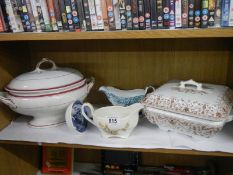 Two tureens, two gravy boats and a ladle.