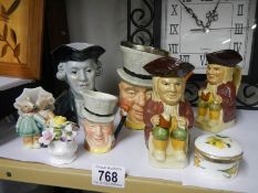 A mixed lot including Toby jugs, trinket box etc.,