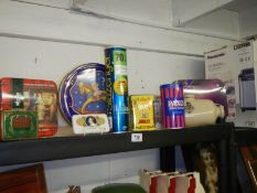 A shelf of collector's tins.