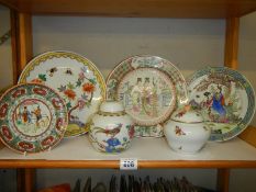 Four oriental plates and two lidded pots.