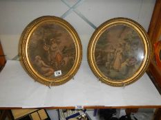 A pair of framed and glazed late Victorian oval engravings.