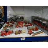 A quantity of die cast fire engines.