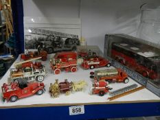 A quantity of die cast fire engines.