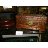 A Chinese carved wood box and a wooden dish.