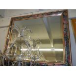 A bevel edged mirror in fancy coloured frame. COLLECT ONLY,.