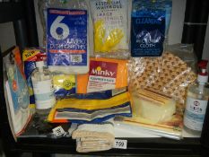 A shelf of assorted cleaning cloths etc.,