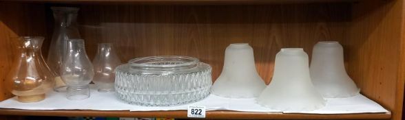 A quantity of glass lampshades.