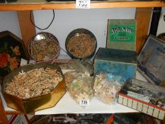 A shelf of old wooden jigsaw puzzles, completeness unknown