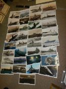 Approximately 30 old images of battleships.