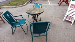 A circular garden table and three as new chairs, COLLECT ONLY.