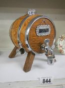 A miniature oak whisky barrel.