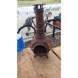 A cast iron garden chimenea. COLLECT ONLY.