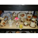 A shelf of ceramics including vases, jugs etc.,