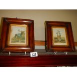 A pair of small framed and glazed coloured engravings.