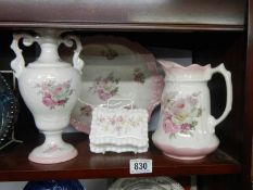 A small jug and basin set and a vase.