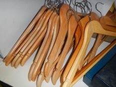 A quantity of good wooden coat hangers.