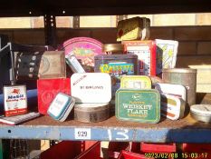 A shelf of collector's tins.