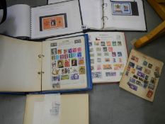 A quantity of stamp albums with stamps.