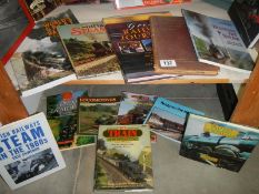 Two shelves of steam railway books.