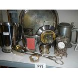 A mixed lot of plated items including tray, tongs, clock etc.,