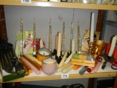 A mixed lot of candlesticks and candles.