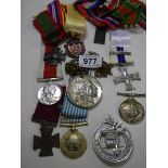 A mixed lot of medallions, brooches etc.,