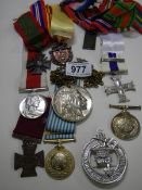 A mixed lot of medallions, brooches etc.,