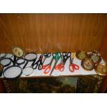 A mixed lot of magnifying glasses, scissors and small gilded photo frames.