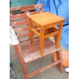 An outside wooden seat and a stool