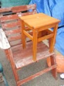 An outside wooden seat and a stool