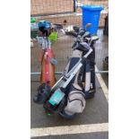 A large quantity of golf clubs in 3 bags with a trolley COLLECT ONLY