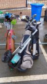 A large quantity of golf clubs in 3 bags with a trolley COLLECT ONLY