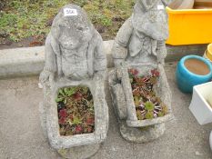 Two stoneware garden planters in the form of a Badger and a Rat pushing wheelbarrows (possibly