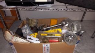 A box of miscellaneous old tools and garden lights