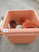 A quantity of plastic garden pots and planters of various sizes