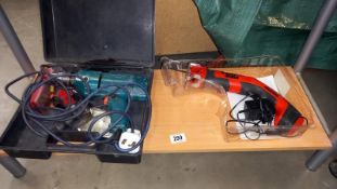 A Black and Decker cordless reciprocating hand saw and a Black and Decker corded drill