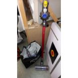 A Dyson V6 total clean cordless vacuum cleaner plus accessories