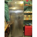 A Whirlpool stainless steel fridge freezer