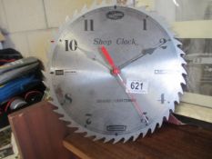 A Craftsmans Tools clock in the shape of a saw