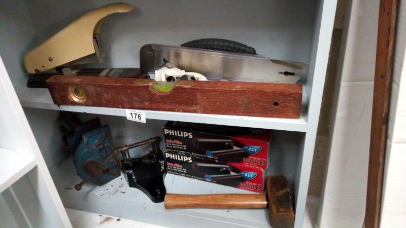 2 shelves of old tools including industrial stapler & vice etc.