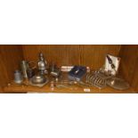 A quantity of silver plated items including toast racks, butter dish and policeman money box etc.