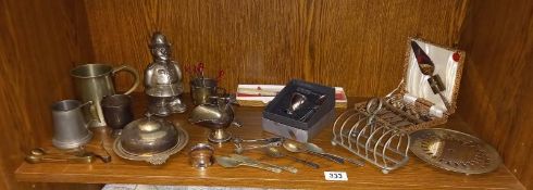 A quantity of silver plated items including toast racks, butter dish and policeman money box etc.