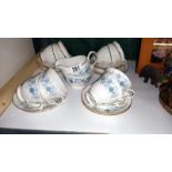 A Royal Stafford and Colclough cups and saucers