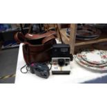 A vintage Polaroid 1000 Land Camera & a quantity of Olympus MD cameras