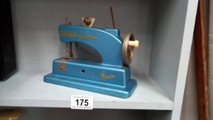 A vintage Vulcan junior child's sewing machine